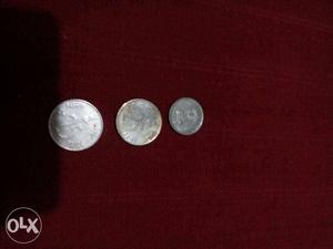 Three Round Silver-colored Indian Paise Coins
