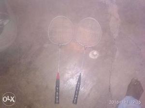 Two Black-and-white Badminton Rackets