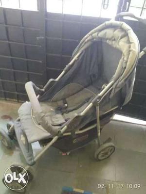 Baby's Gray And White Stroller