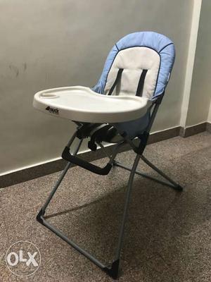Baby's White, Blue, And Black High Chair With Tray