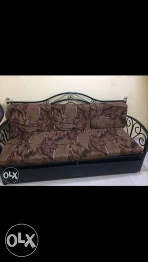 Black And Brown Metal Couch With Cushion