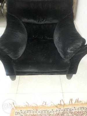 Black Suede Sofa Chair With Throw Pillow