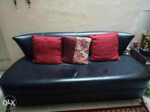 Black sofa from HomeTown, leather look