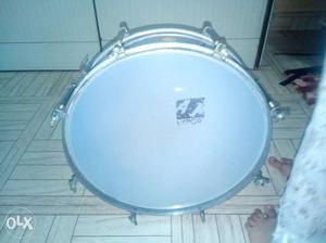 Drum with stick and extra drum sheet