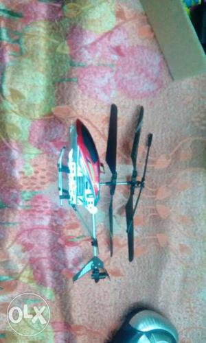 Gray, Red, And Black rechargeable Toy Helicopter with