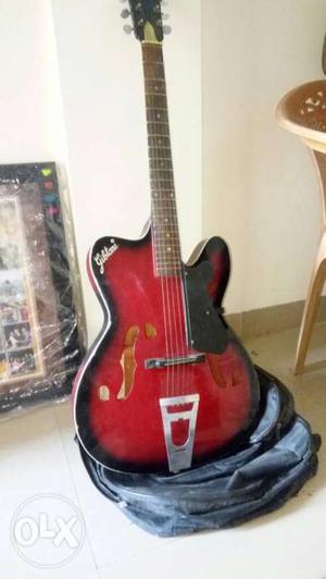 Red And Black Archtop Guitar