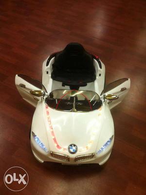 Toddler's White And Black BMW Ride-on Toy Car