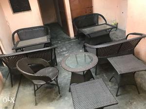 Two Black Wicker Armchairs And Table
