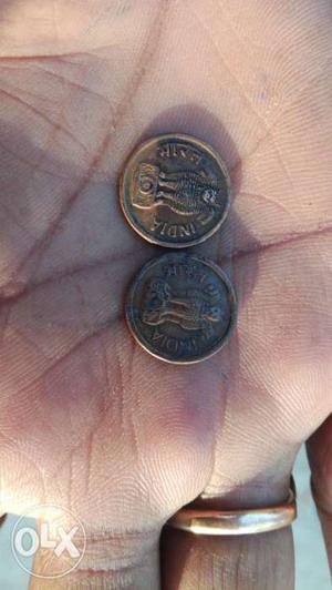 Two Bronze-colored Commemorative Coins