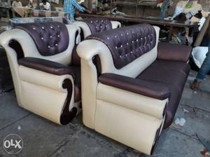Two White Leather Sofa Chairs