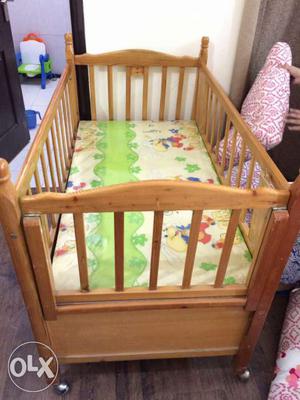 Wooden cot with storage and mattress, pillow