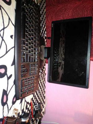 Black Flat Screen Monitor And Keyboard