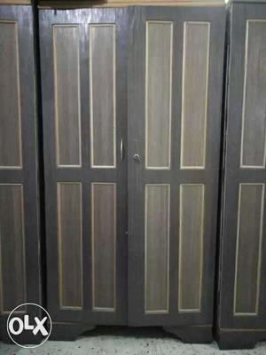 Four Brown And Black Wooden 4-panel Doors