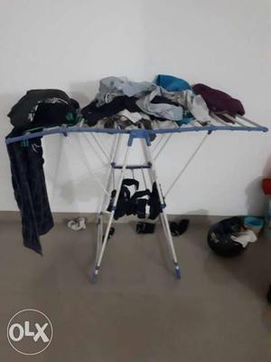 Gray And Silver Clothes Table