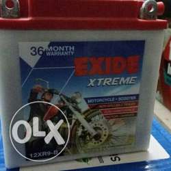 Red And White Exide Xtreme Vehicle Battery