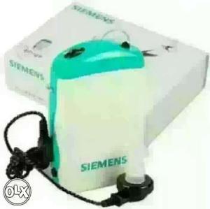 White And Green Siemens hearing Appliance