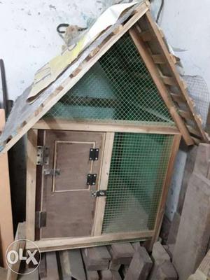 Brown And Green Wooden Pet House