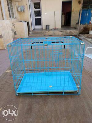 Pet cage with bottom tray. Sparingly used.