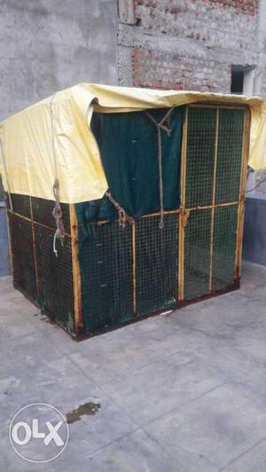 Yellow And Green Metal Dog Cage