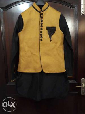 Black kurta with pajami and yellow embroidered