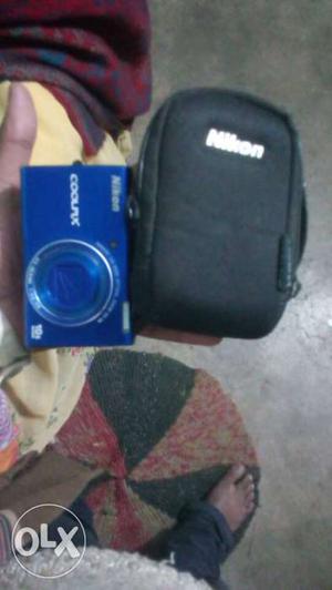 Blue Nikon Coolpix Point-and-shoot Camera With Pouch