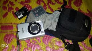 Gray Canon Compact Camera With Bag