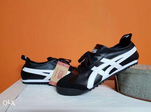 Pair Of Black-and-white Asics Athletic Shoes