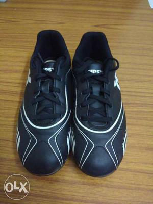 Pair Of Black-and-white kipsta football boots