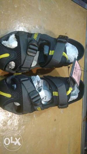 Pair Of Black-and-yellow Flat Hiking Sandals