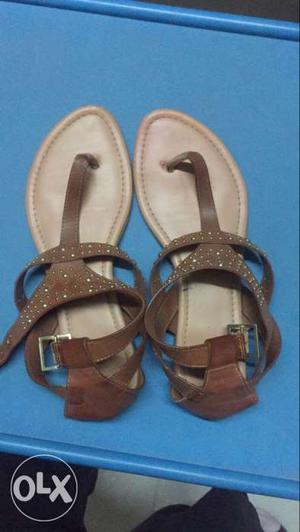 Pair Of Brown Leather T-strap Flat Sandals