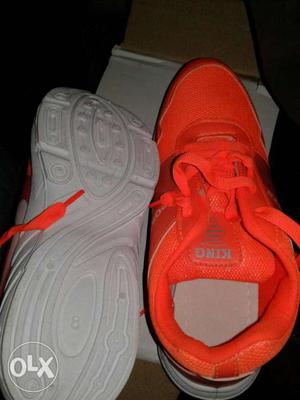 Pair Of Orange King Athletic Shoes