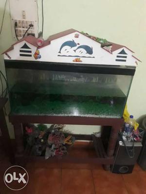 Fish Tank with brown wooden stand