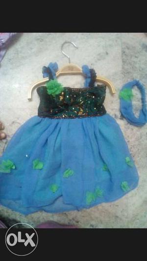 Green and blue color baby frock with matching