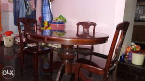 Urgent sale.wood dinning table with 4 chairs..