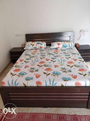 White, Orange, And Blue Floral Bedspread