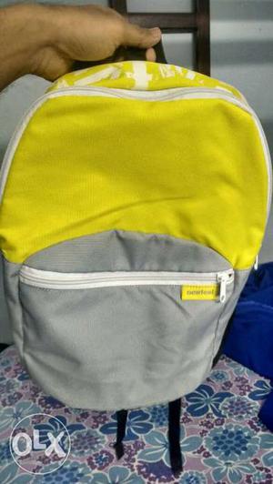 White, Yellow, And Gray Backpack