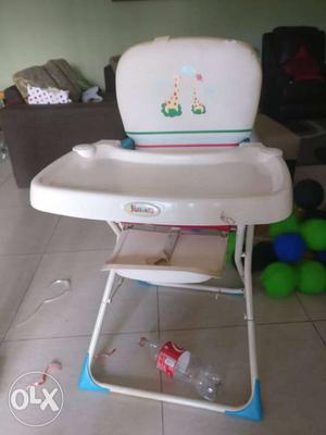 White baby high chair from Juniors