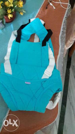 Baby's Teal And White Carrier