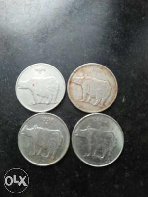 Four Round Silver-colored Indian Coins