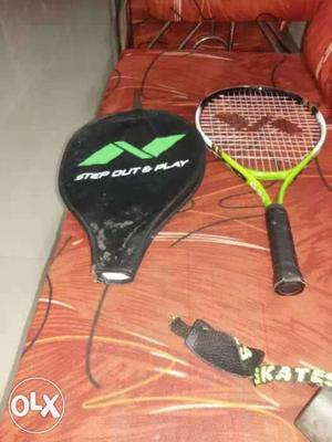Green, White, And Black Tennis Racket