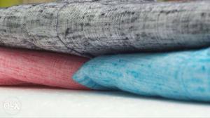Red, Blue, And Gray Textiles