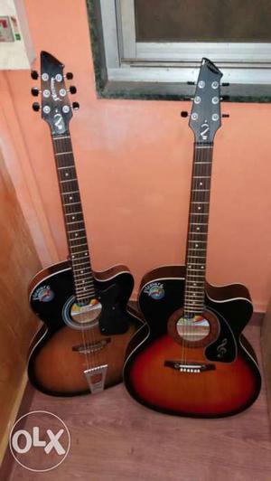 Two Red And Orange Burst Electric Guitars