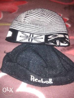 Two White And Black Knit Caps