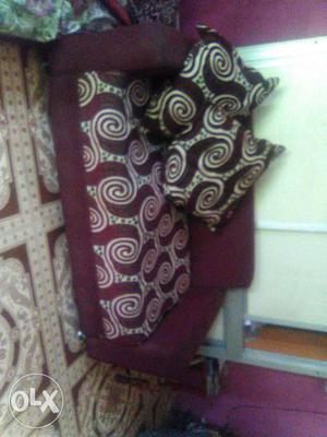 2 Maroon And White Loveseat of different sizes..
