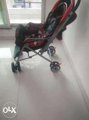 Baby's Black And Red Convertible Stroller