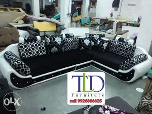 Black And White Leather Sectional Sofa With Throw Pillows