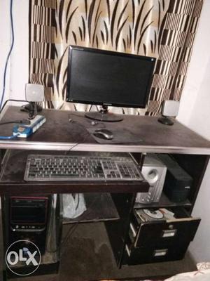 Computer in new condition with table