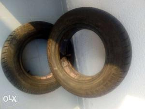 Two Brown Wooden Car Tires