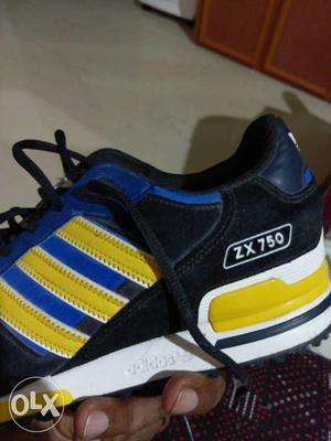 Black, Yellow, And Blue Adidas ZX 750 Sneaker