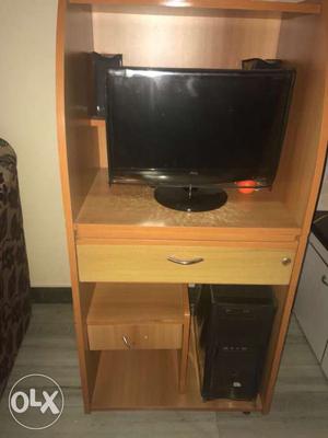 Flat Screen Television With Brown Wooden TV Hutch
